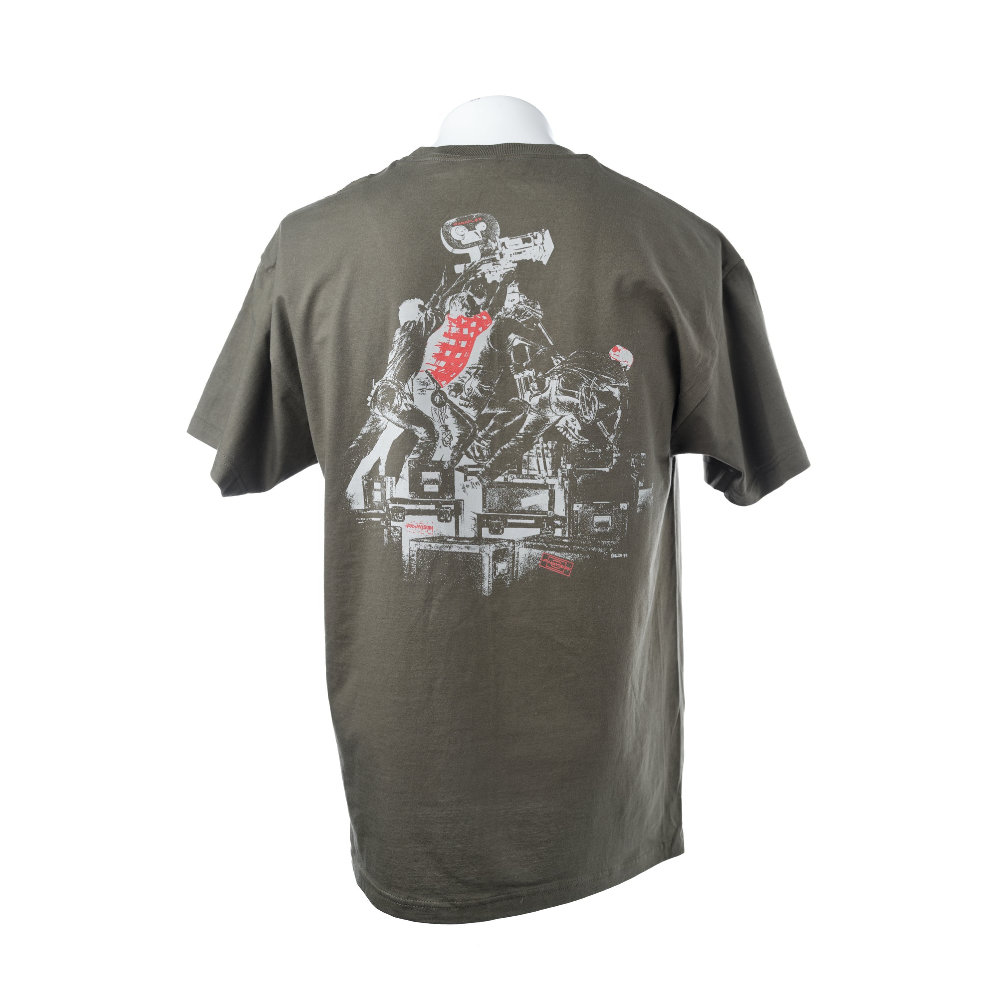 An olive green short-sleeve t-shirt shown from the back on a white mannequin torso, featuring a large graphic print of a several film crew struggling to raise the camera.